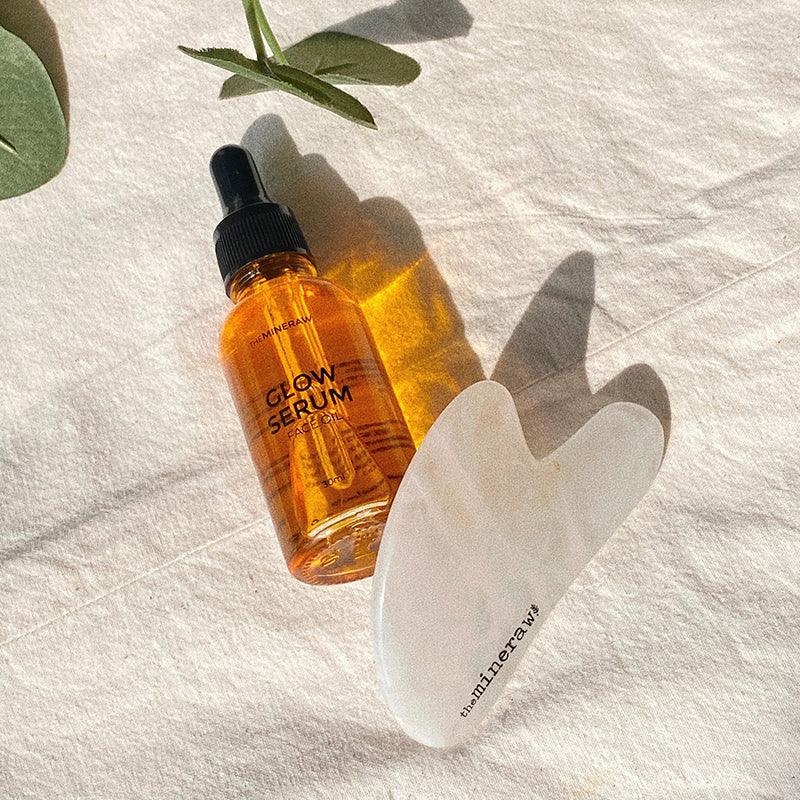 the mineraw glow serum clear quartz gua sha massage tool dynamic duo set