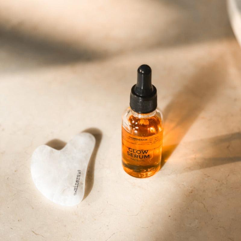 the mineraw glow serum face oil gua sha face tool massage clear quartz